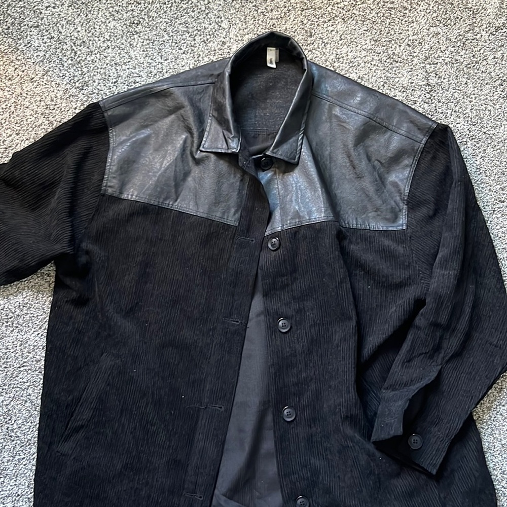 Leather and denim jacket. Size large, could fit bigger or smaller.